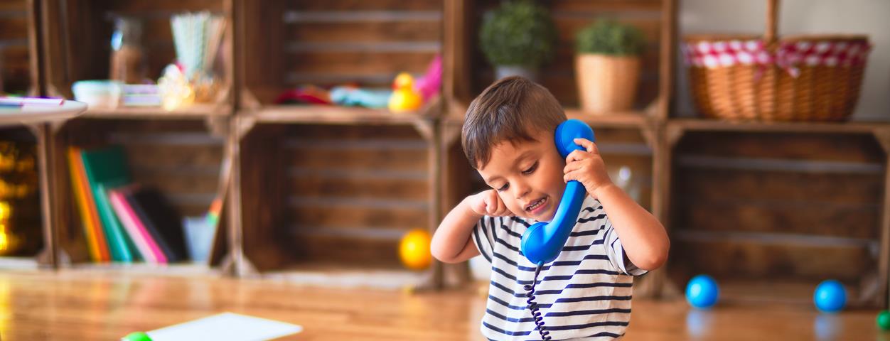 Boy playing with toy phone